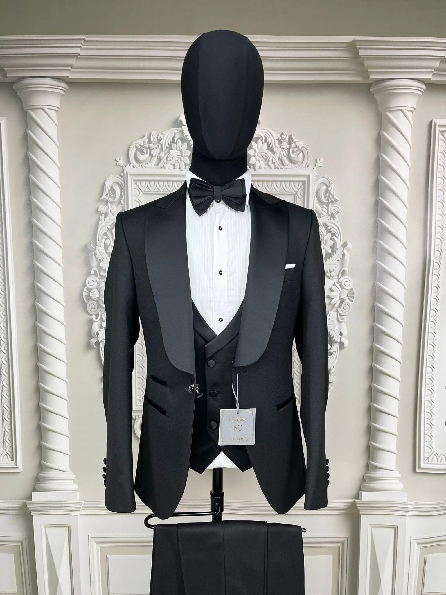 Single Button Three Pieces Tuxedo Suit with contrasting Lapel, matching bow tie and Black Pants.