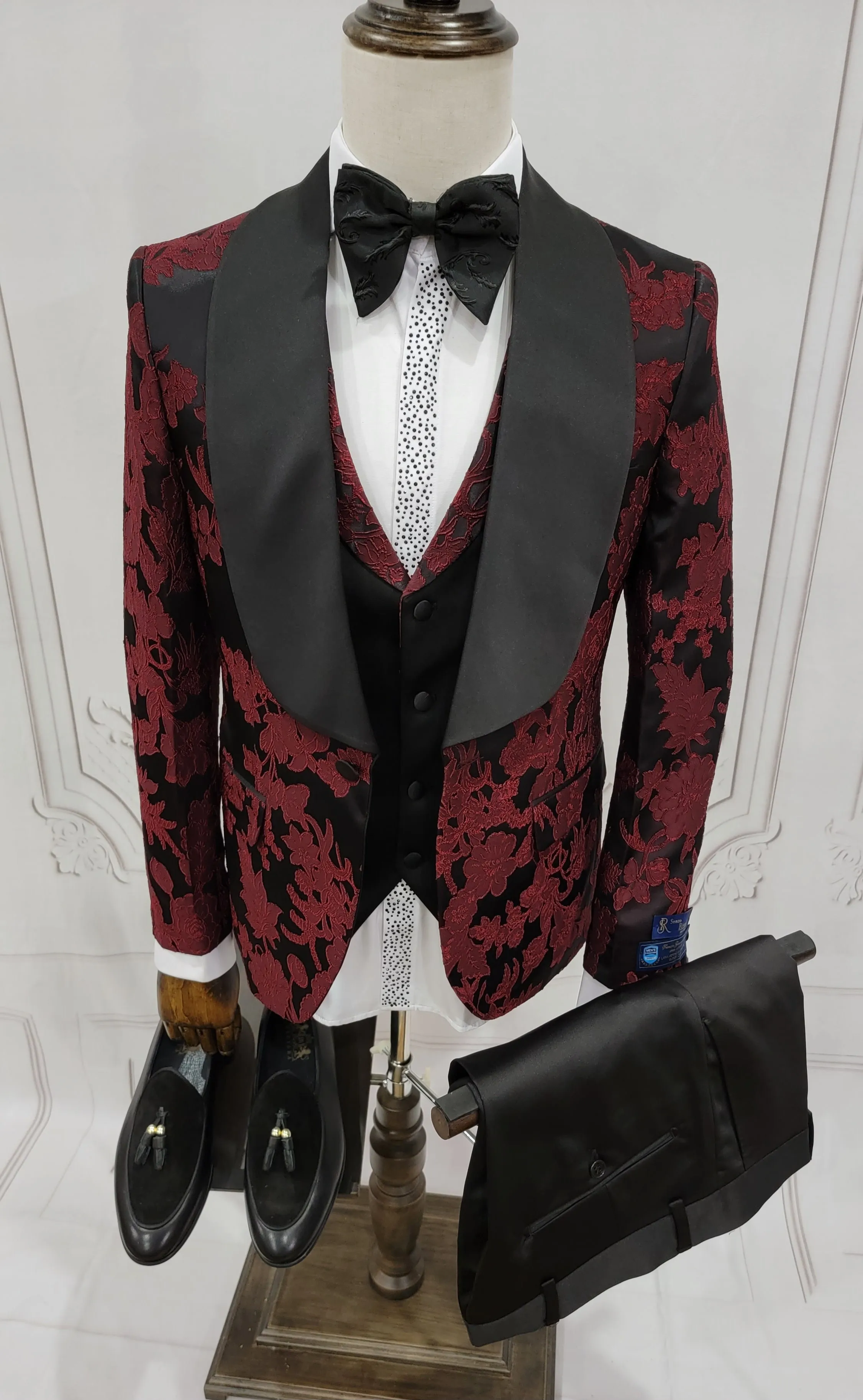 Three Pieces Tuxedo Suit with Black Satin Lapel, Contrasting black vest and black dress pants.