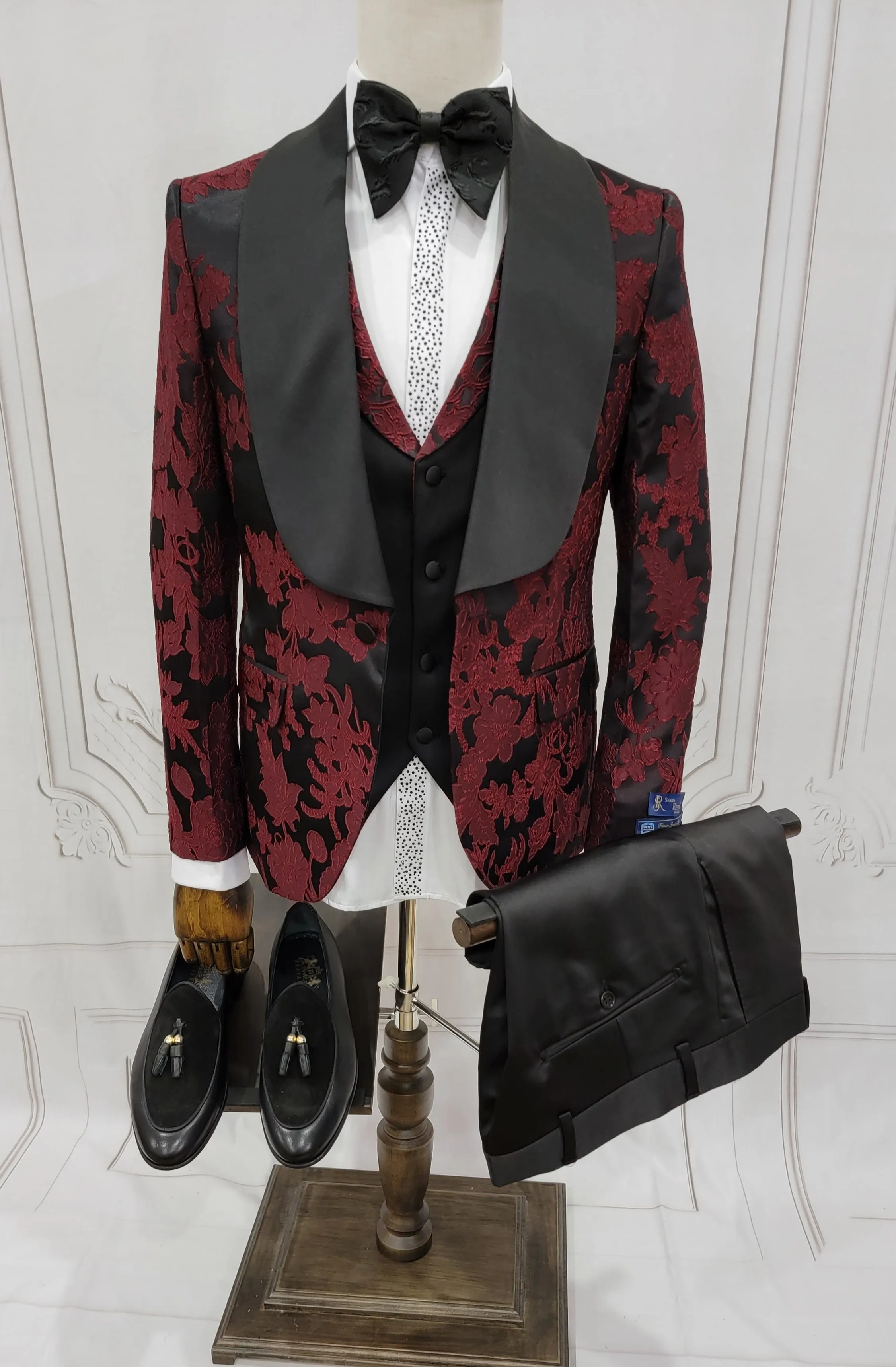Three Pieces Tuxedo Suit with Black Satin Lapel, Contrasting black vest and black dress pants.