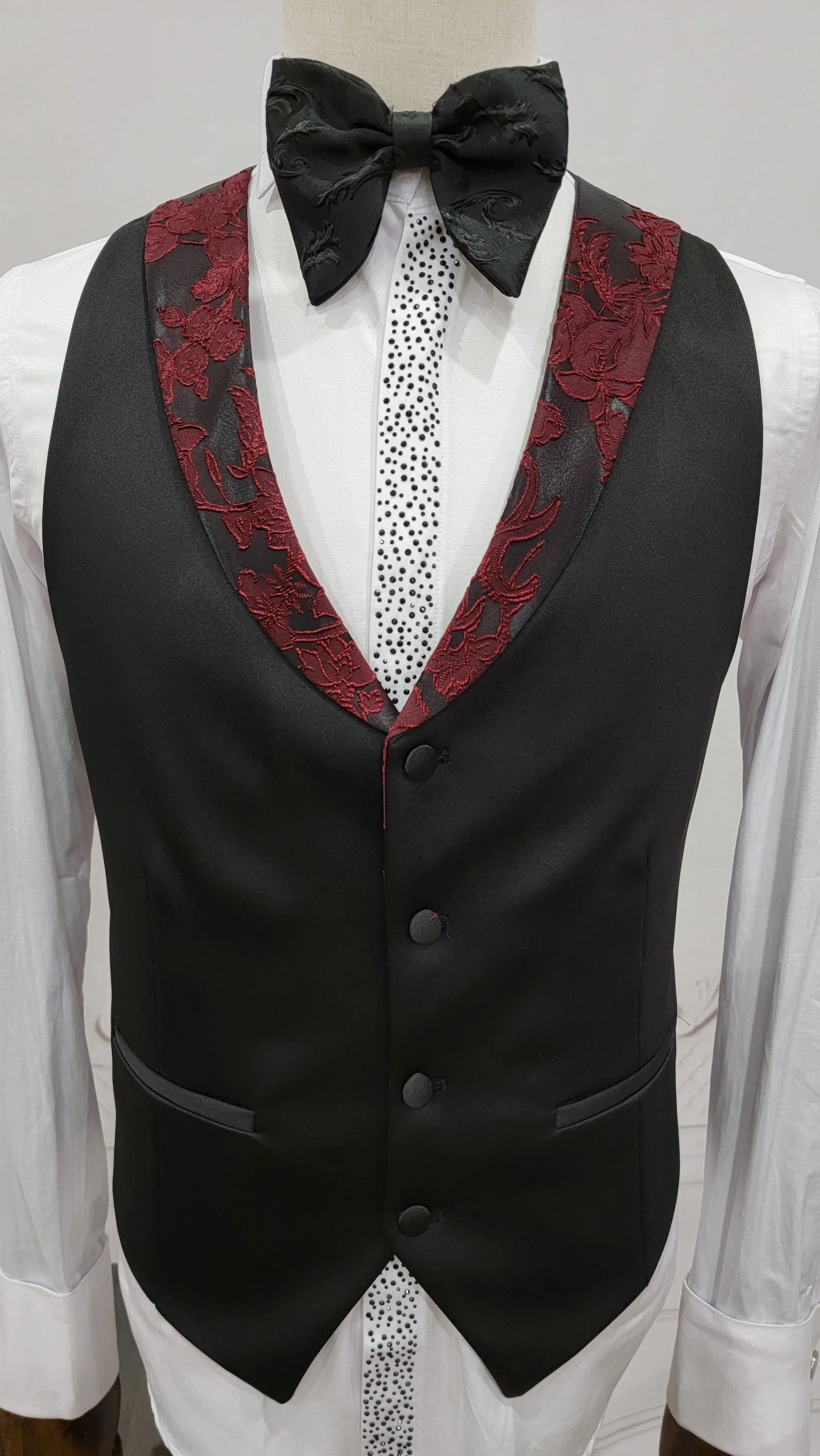 Three Pieces Tuxedo Suit with Black Satin Lapel, Contrasting black vest and black dress pants.