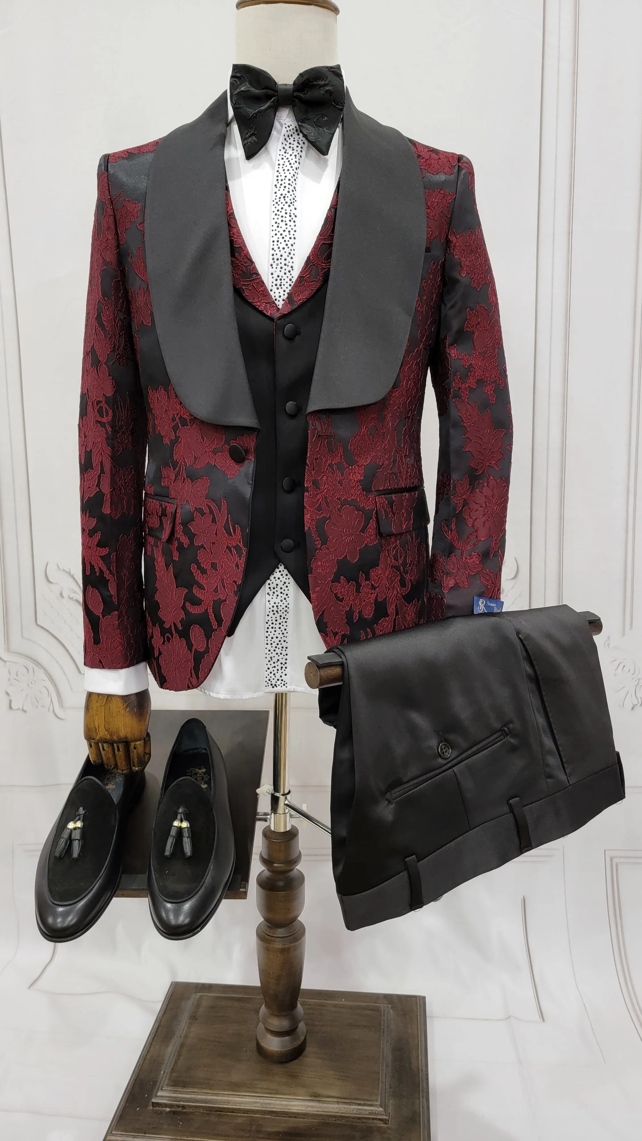 Three Pieces Tuxedo Suit with Black Satin Lapel, Contrasting black vest and black dress pants.
