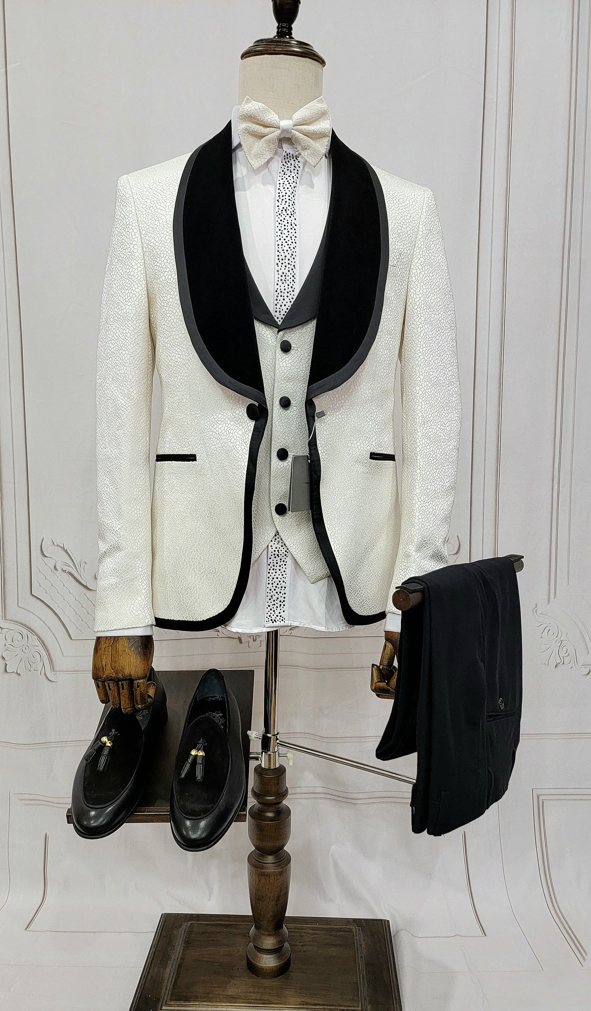 Three Pieces Tuxedo Suit with contrasting black velvet Lapel, matching bow tie and Black Pants.