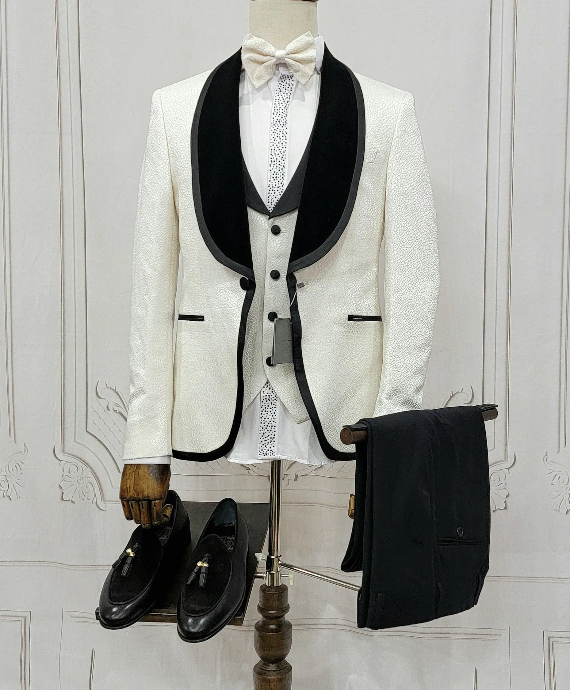 Three Pieces Tuxedo Suit with contrasting black velvet Lapel, matching bow tie and Black Pants.