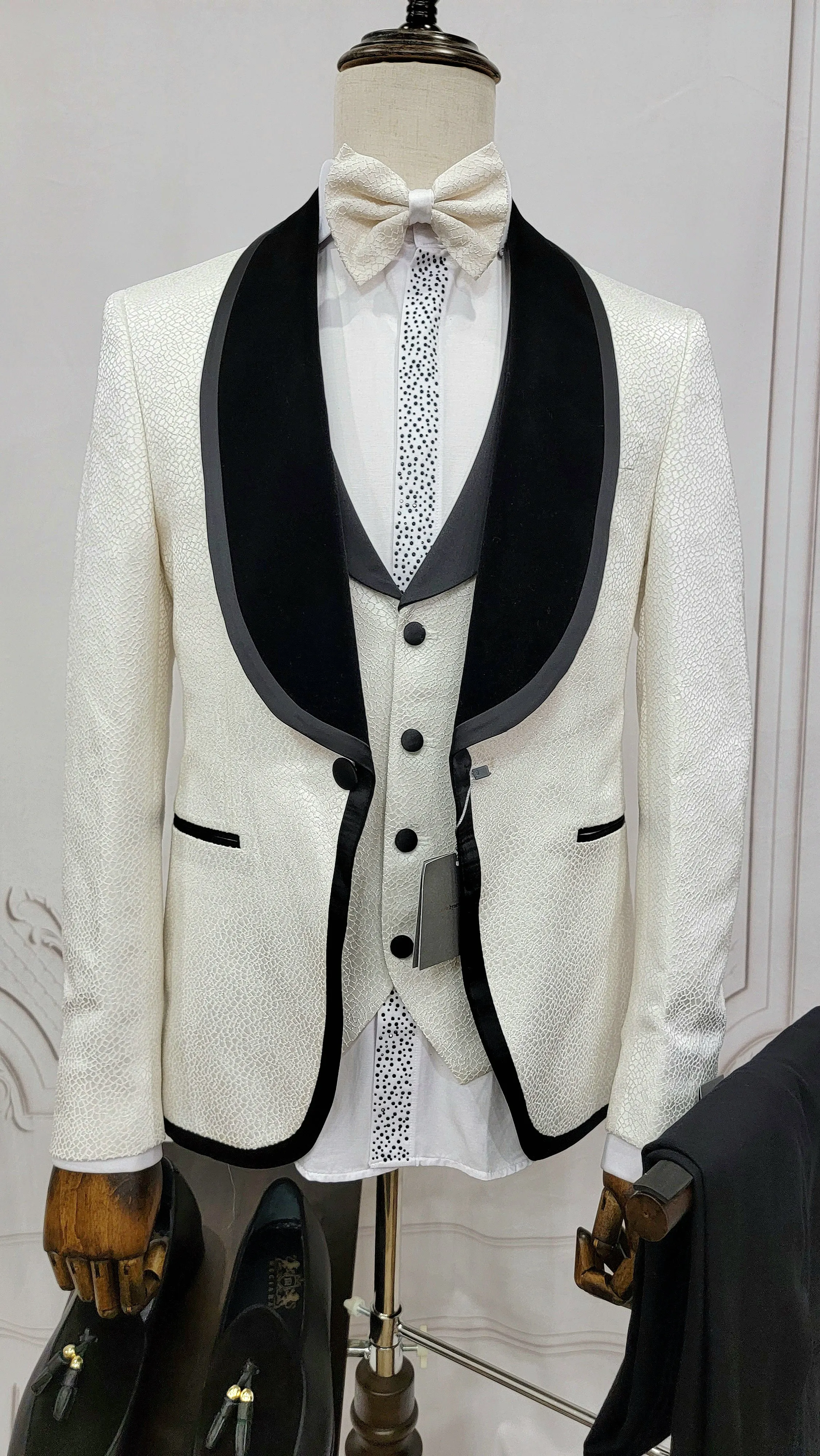 Three Pieces Tuxedo Suit with contrasting black velvet Lapel, matching bow tie and Black Pants.
