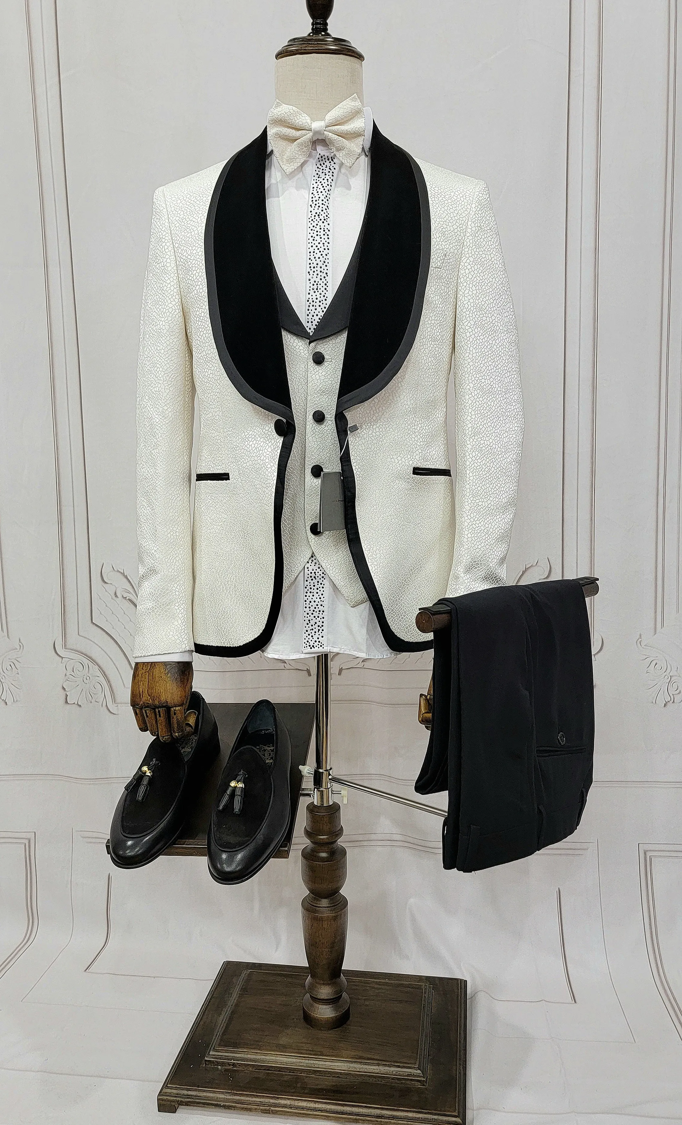 Three Pieces Tuxedo Suit with contrasting black velvet Lapel, matching bow tie and Black Pants.