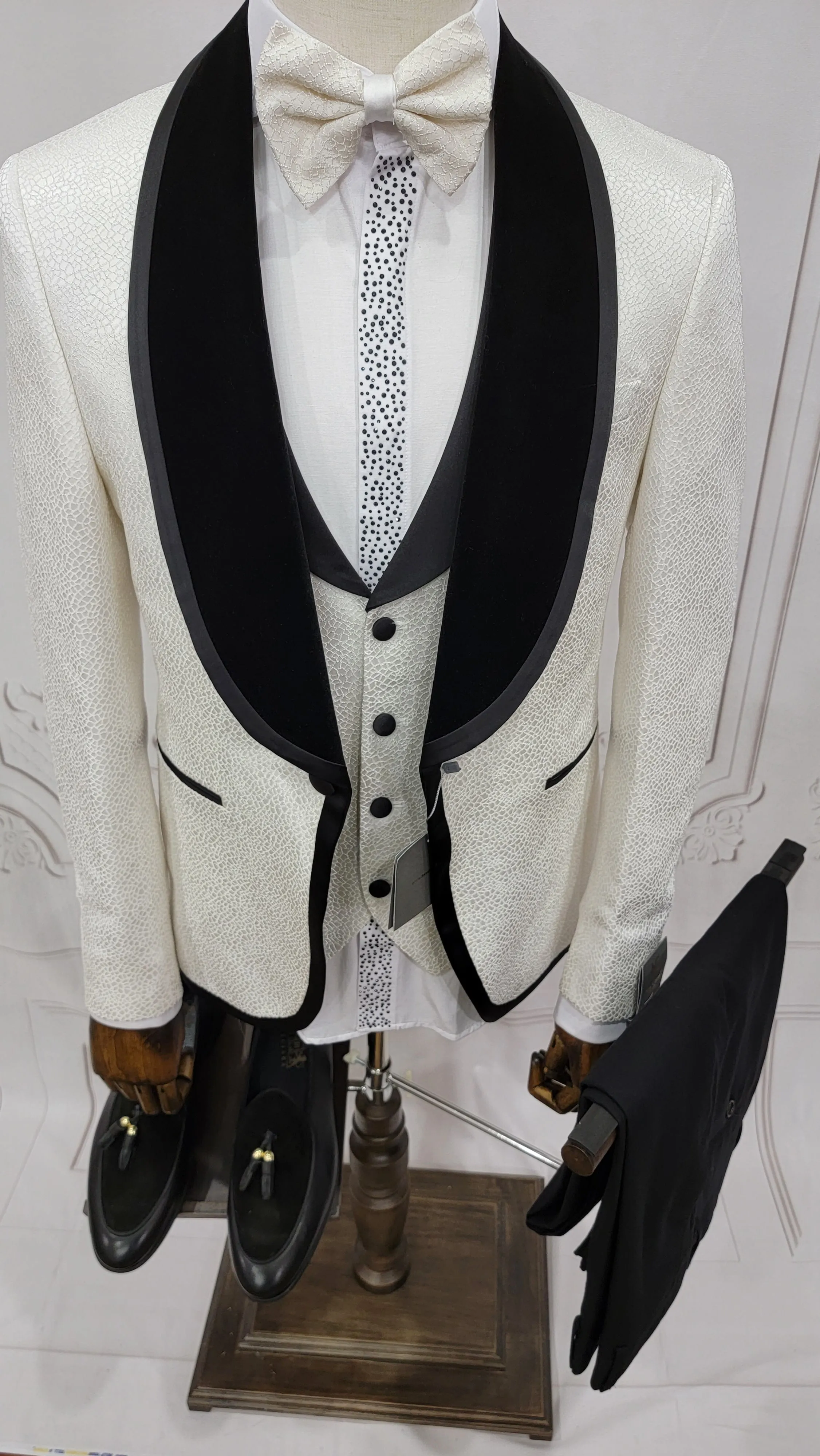 Three Pieces Tuxedo Suit with contrasting black velvet Lapel, matching bow tie and Black Pants.