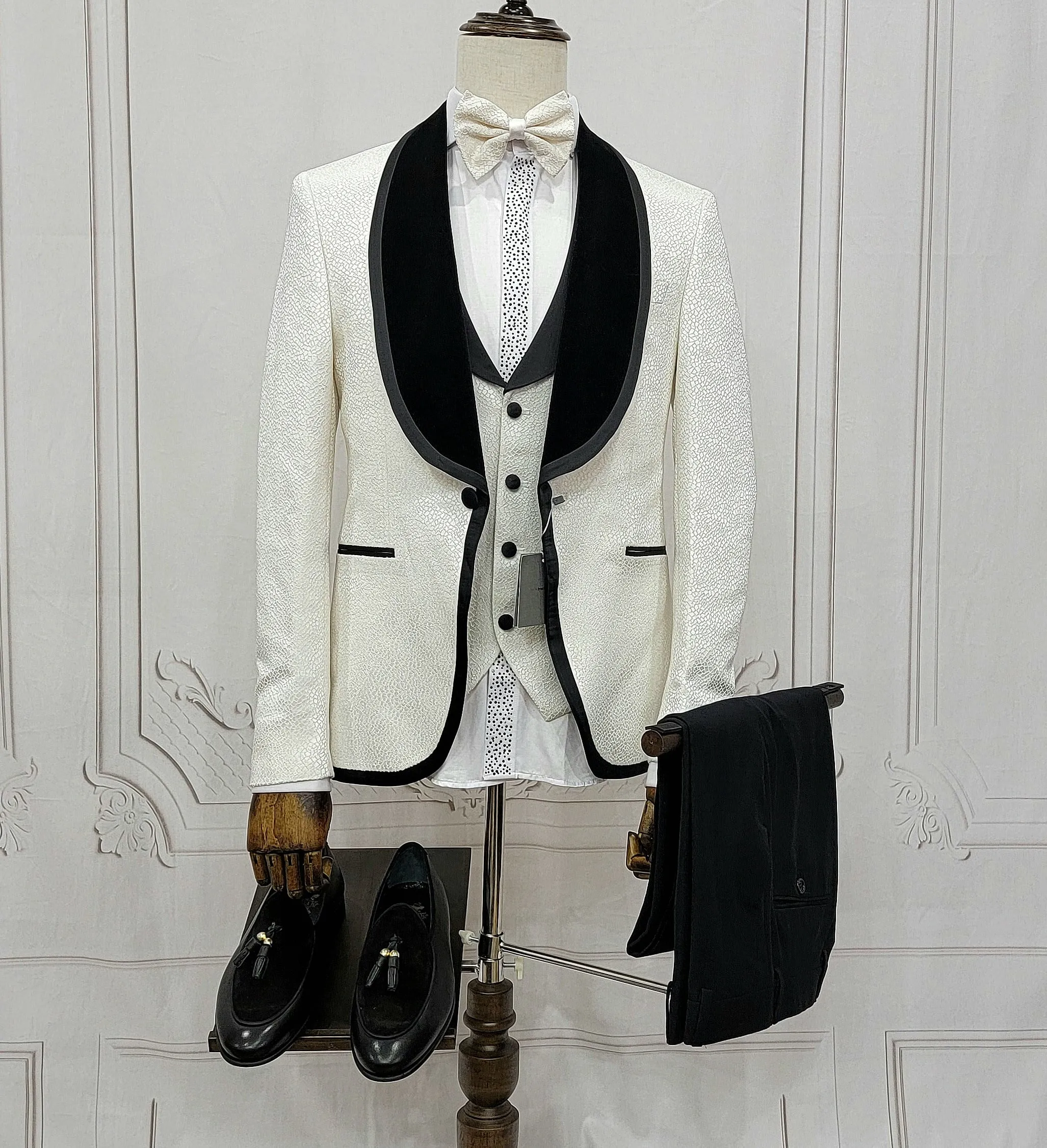 Three Pieces Tuxedo Suit with contrasting black velvet Lapel, matching bow tie and Black Pants.