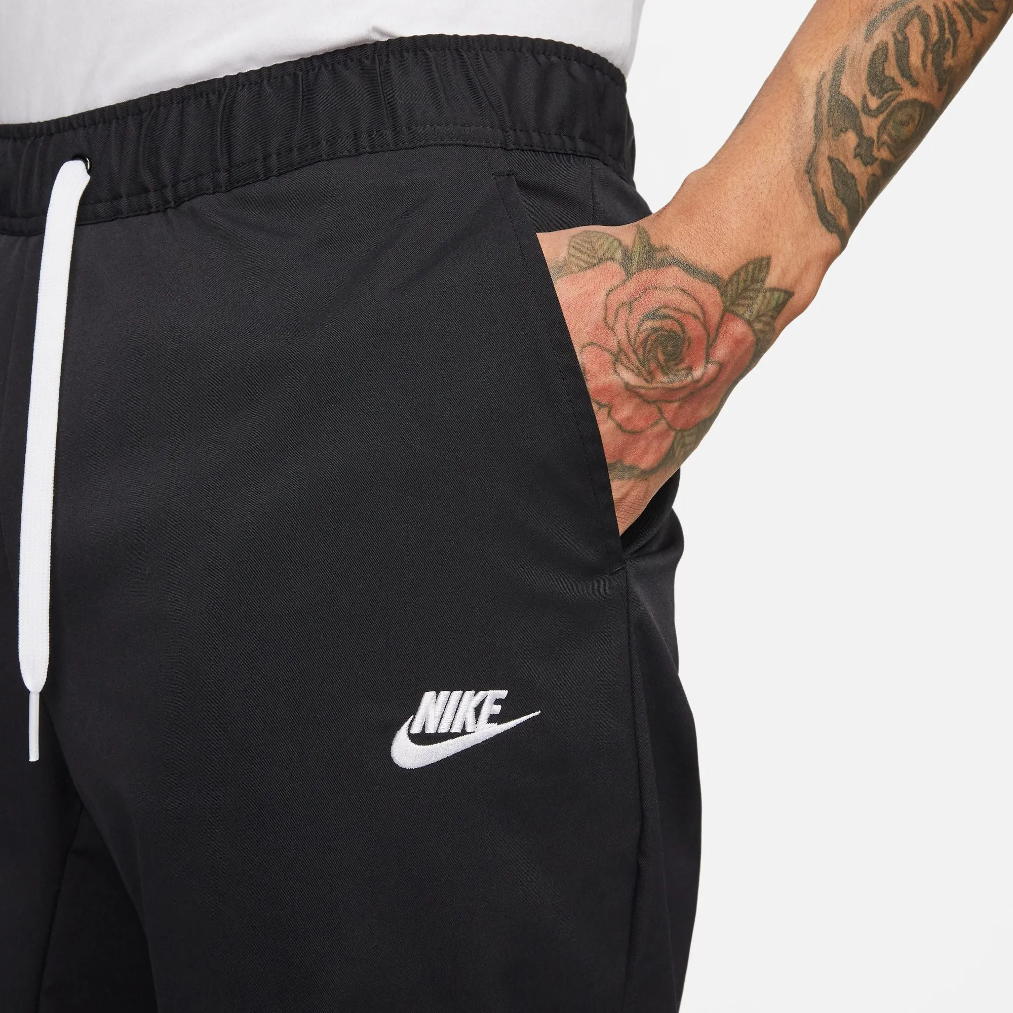 WOVEN TAPERED LEG PANTS - Pantalons d'entraînement pour hommes - Nike