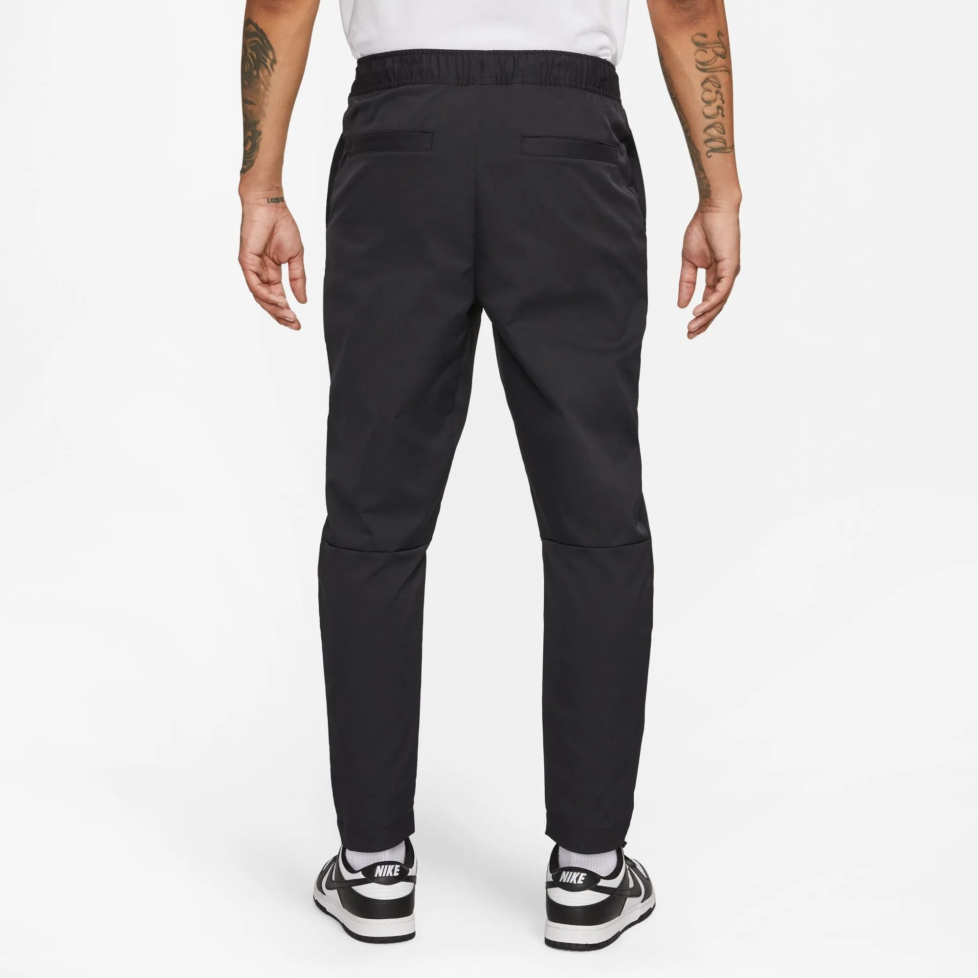 WOVEN TAPERED LEG PANTS - Pantalons d'entraînement pour hommes - Nike