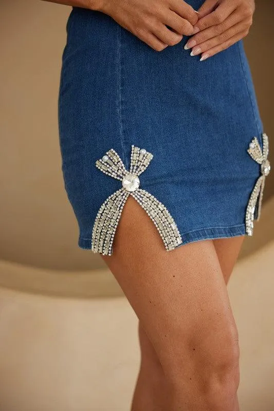 X RIBBON WITH STONE DETAIL SHORT DENIM DRESS